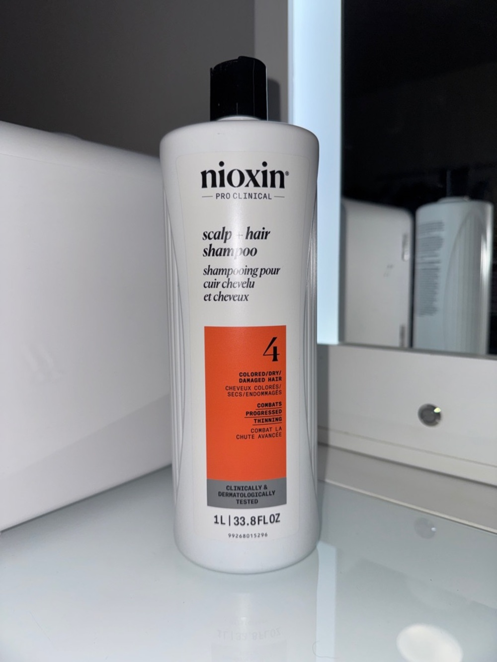 Nioxin Scalp & Hair Shampoo 4 for Colored/Dry Hair - White with Orange Accent